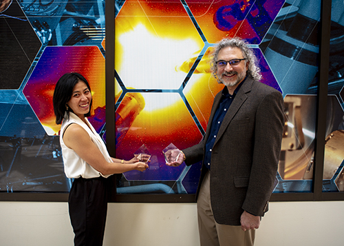 Lawrence Livermore's Tammy Ma and Jeffrey Hittinger pose with their Corones Award paperweights.