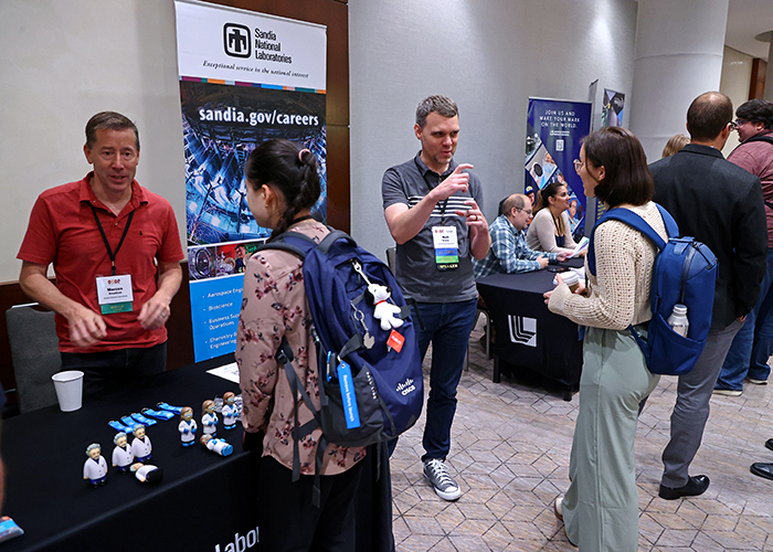 Sandia representatives visit with fellows at the 2025 program review.